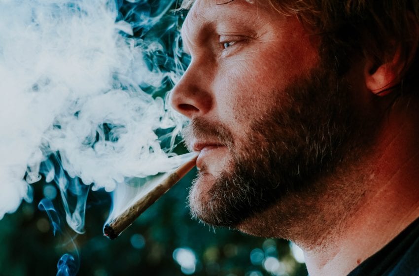Man smoking marijuana joint